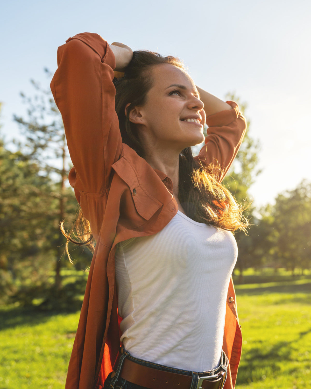 Smiling woman representing spring wellness and internal detox support with Aminocare® Broc-Colinic in Houston, Texas