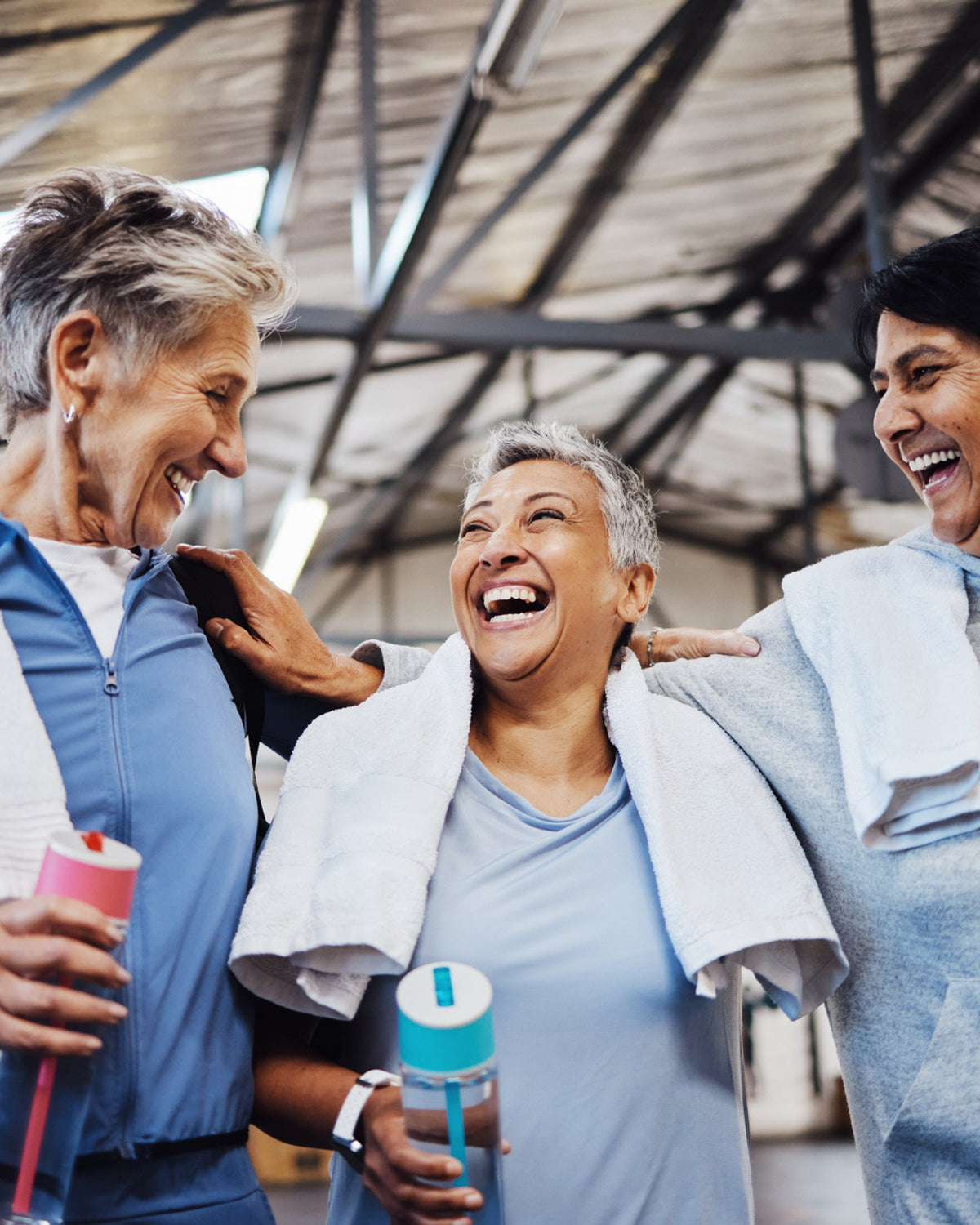 group of middle aged women at the gym laughing representing antioxidant health with Aminocare® A10